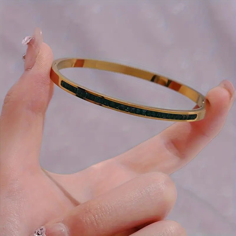 Goudkleurige armband in groen