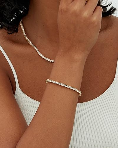 Goudkleurige tennisarmband met briljante steentjes