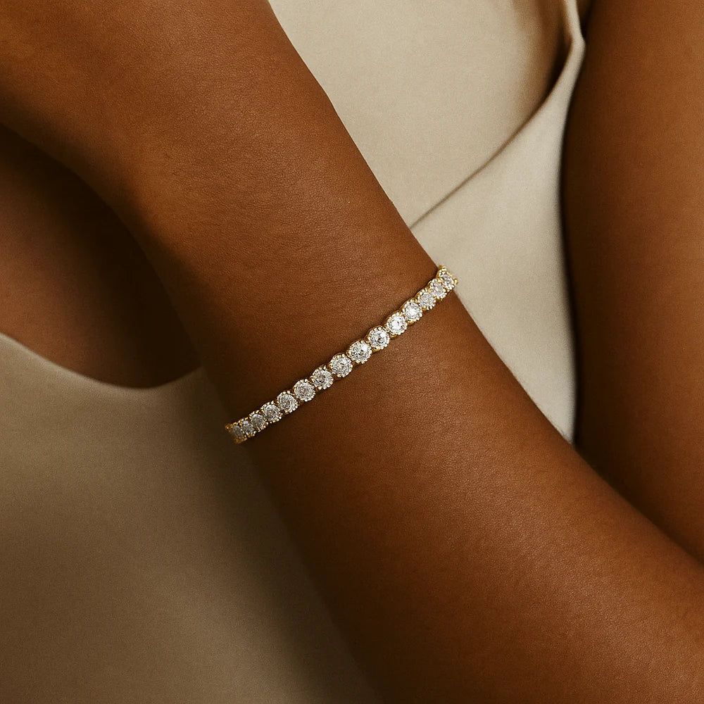 Goudkleurige tennisarmband met briljante steentjes