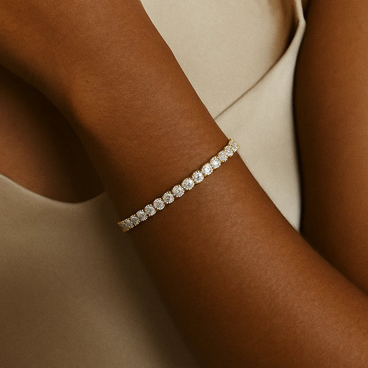 Goudkleurige tennisarmband met briljante steentjes