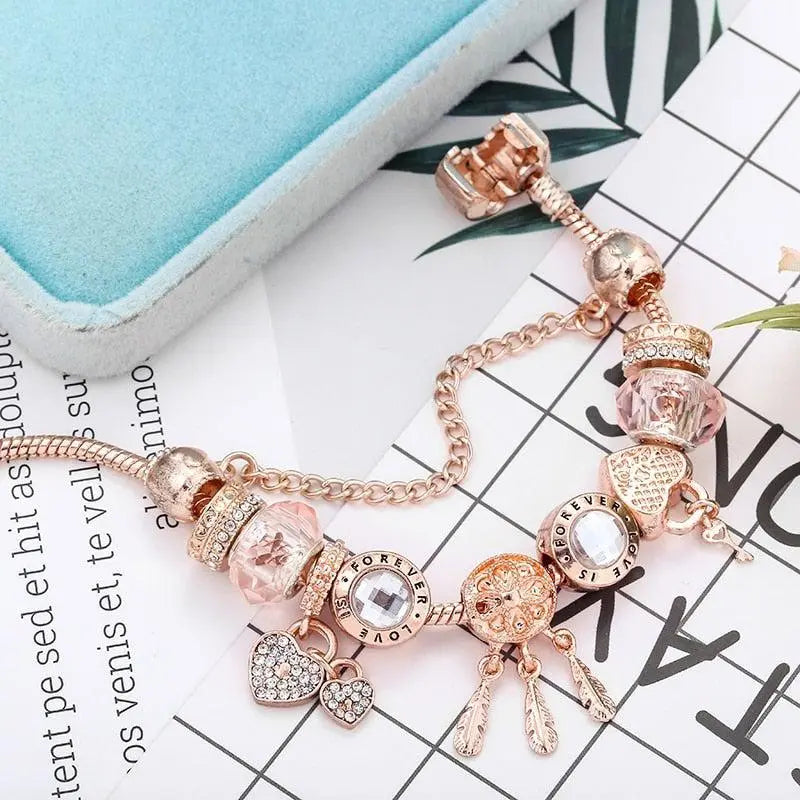 Roze dromenvanger-armband met zilverkleurige bedels