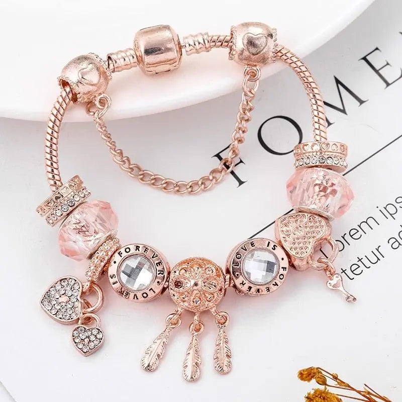 Roze dromenvanger-armband met zilverkleurige bedels