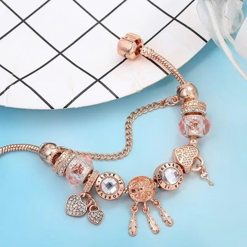 Roze dromenvanger-armband met zilverkleurige bedels