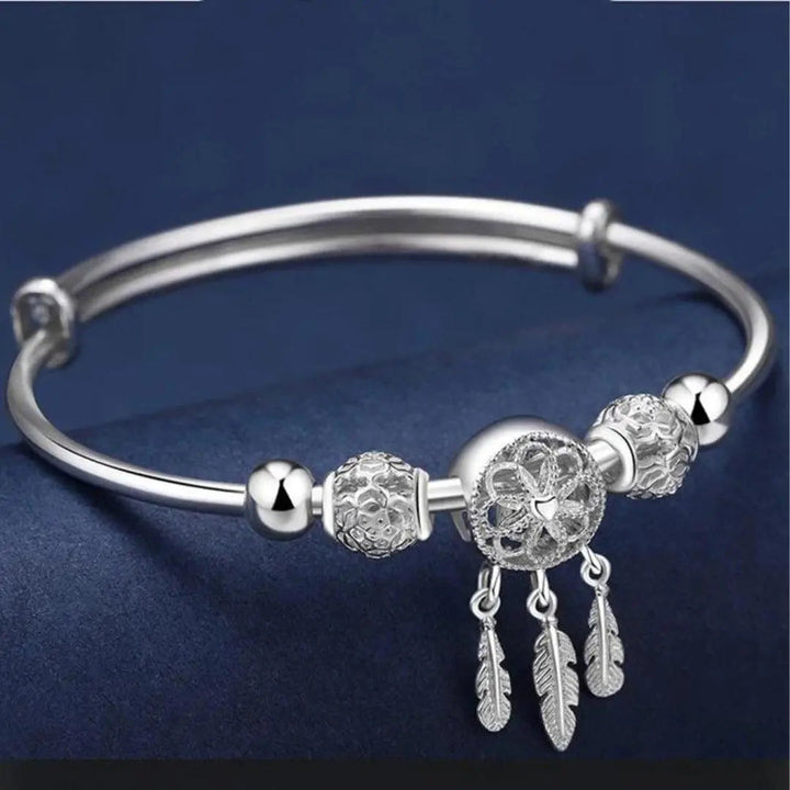 Zilverkleurige bangle met dromenvanger