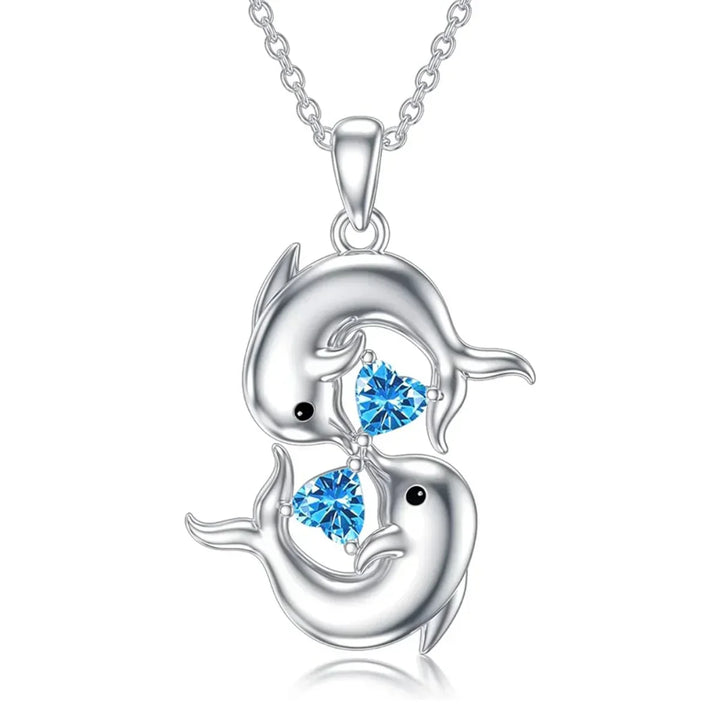 Zilverkleurige ketting met dubbele dolfijnen en blauwe kristalglans