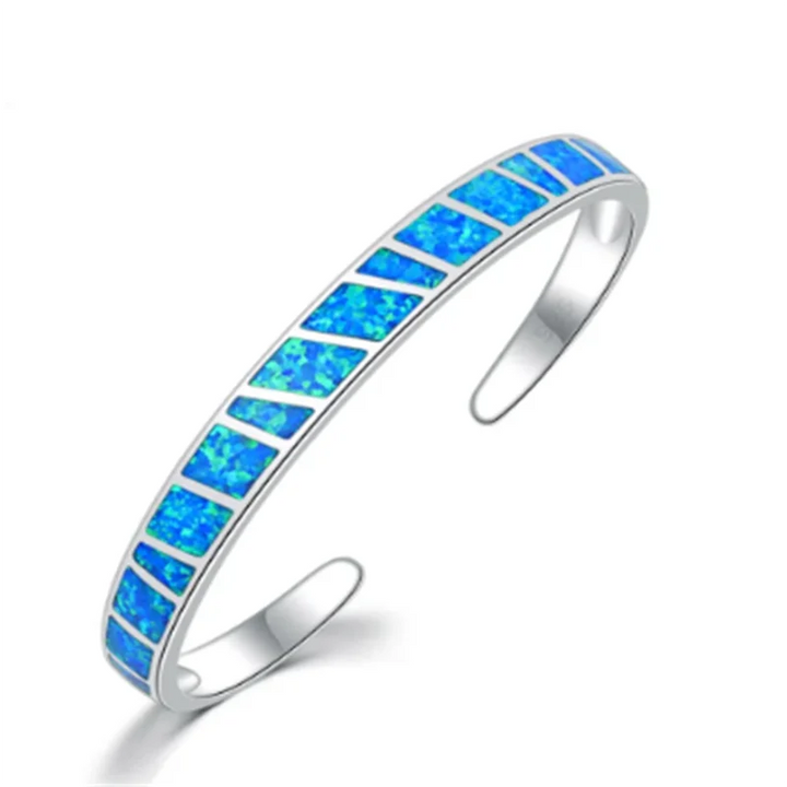 Verstelbare zilverkleurige armband met blauwe opaalglans