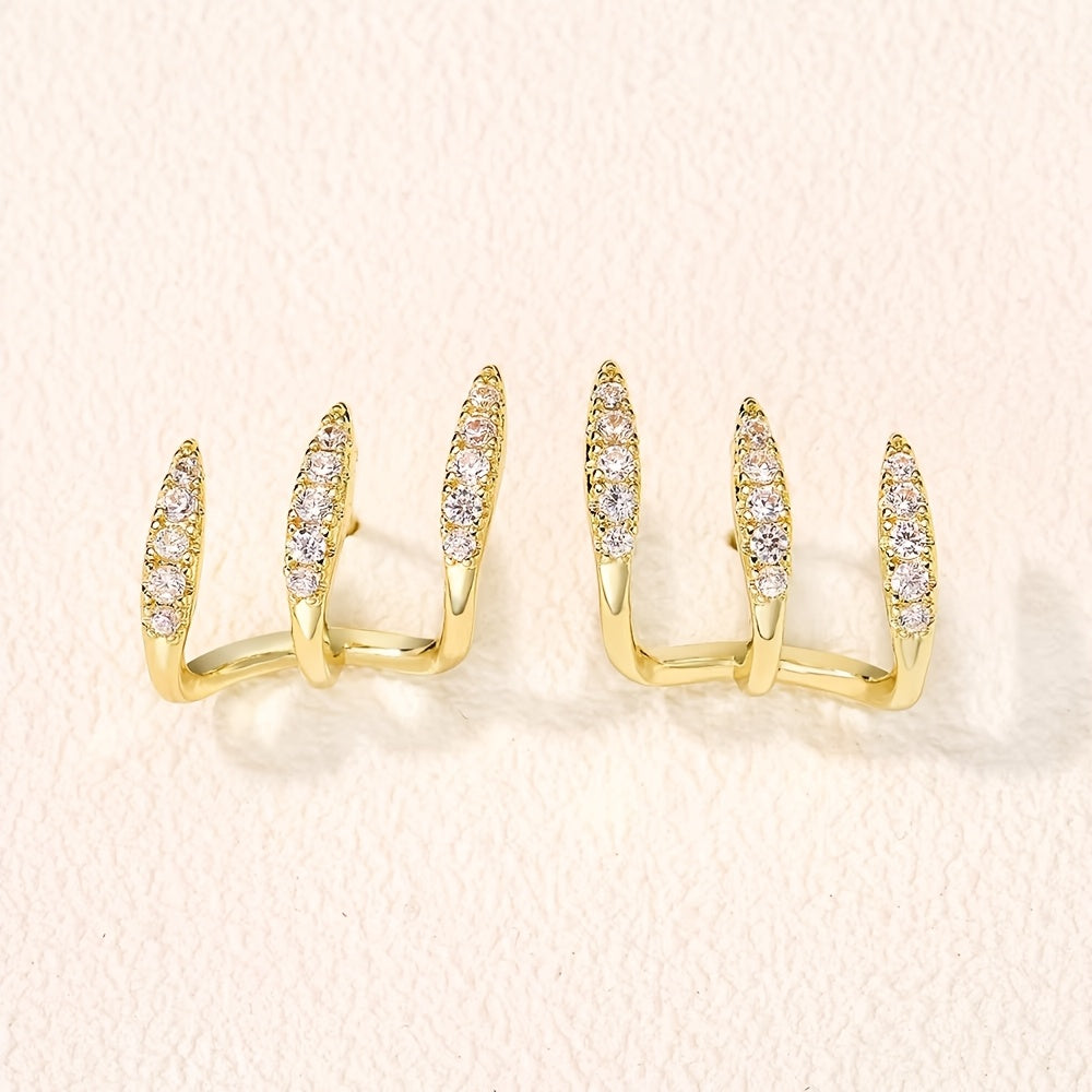 Elegante oorbellen met kristalsteentje in drievoudige zetting