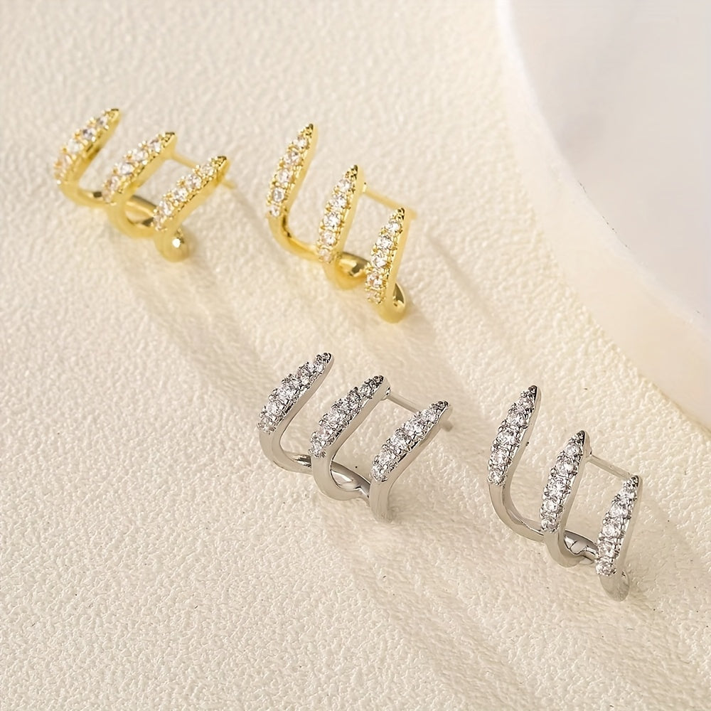 Elegante oorbellen met kristalsteentje in drievoudige zetting
